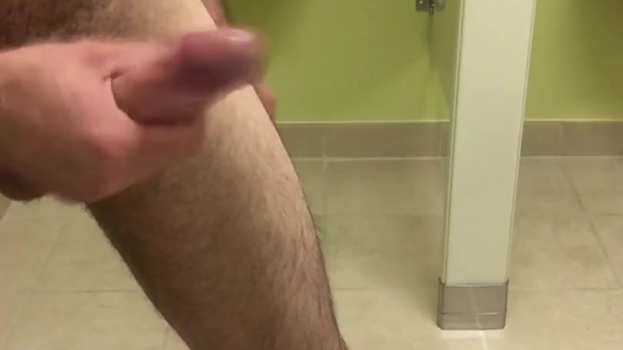 Playing with my well hung white cock in public bathroom