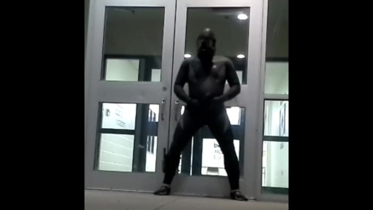 lubed rubber man cums in front of doors