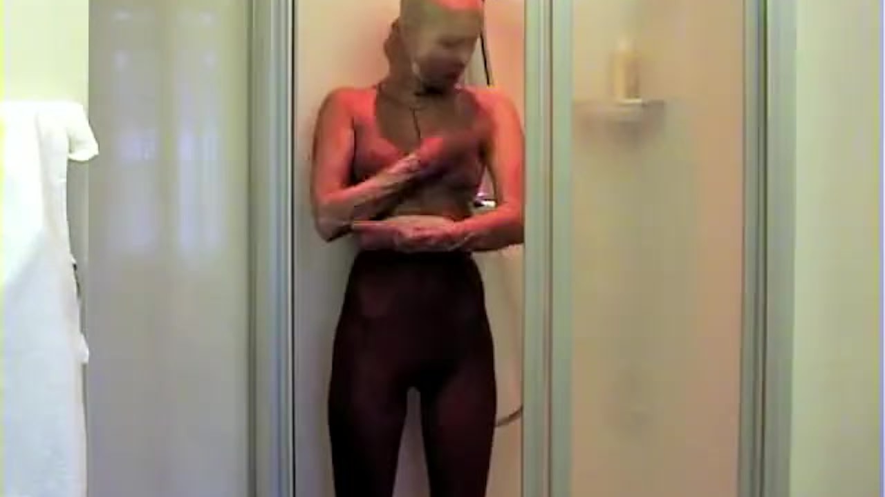 Young Babe Taking A Silky Pantyhose Nylon Encasement Shower