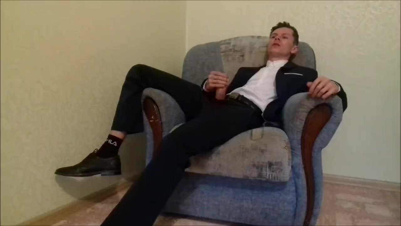 After working in the office, the guy jerks off his cock and ends up in an office suit
