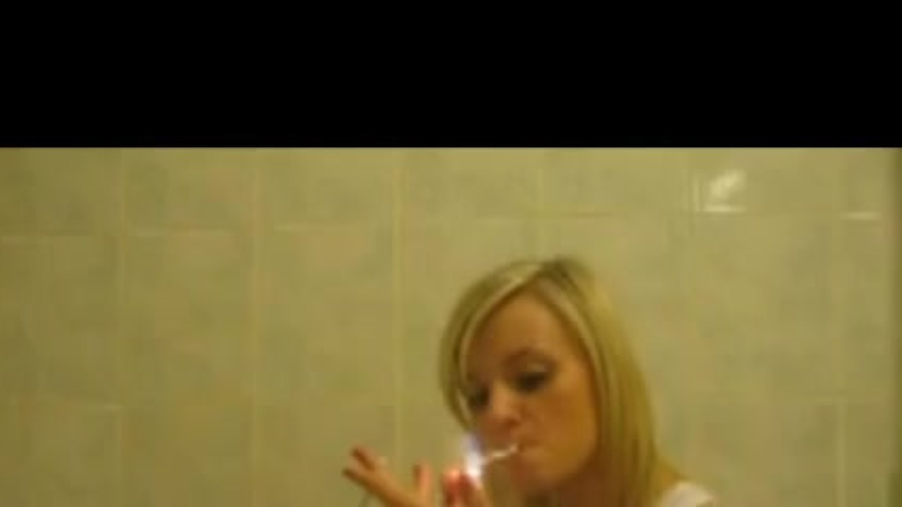 Sexy blondie Smokes In Bath