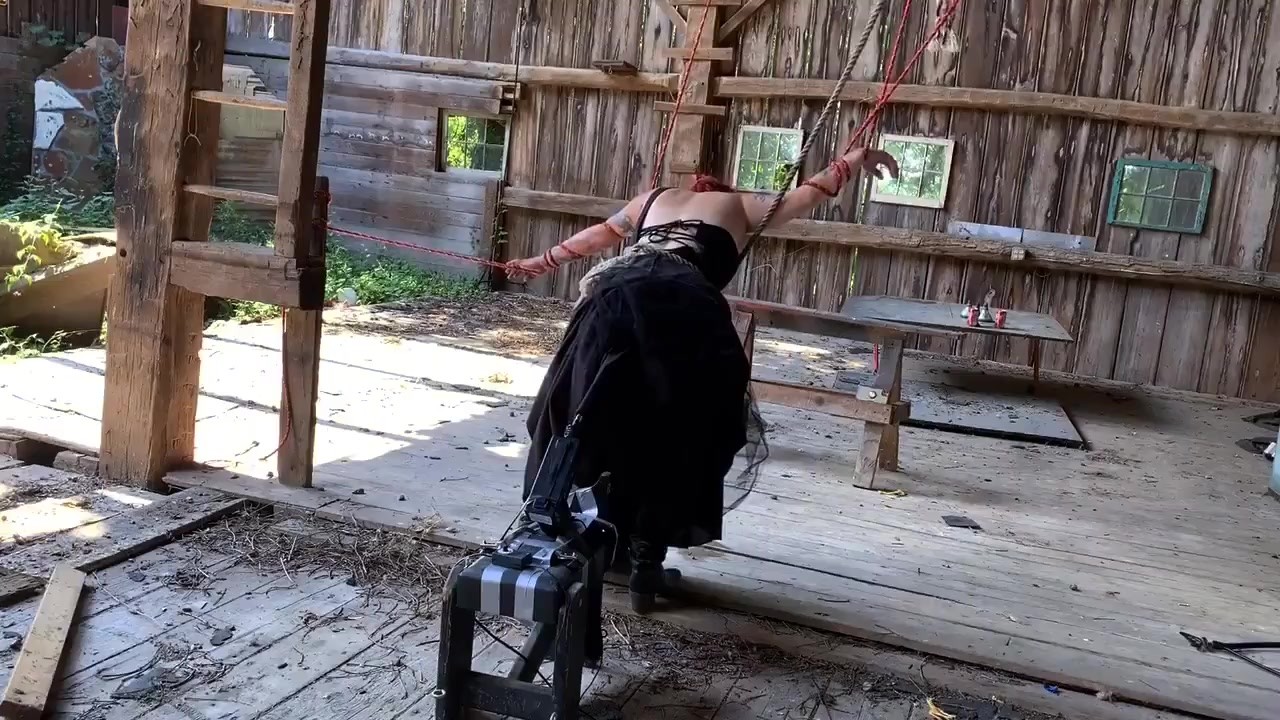 Tied up and fucked by machine in barn