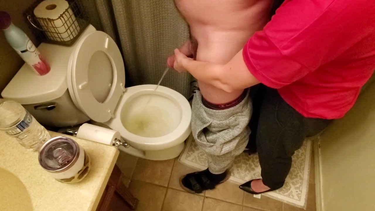 Helping my neighbor by holding his dick while he pees in the toilet while my boyfriend&apos;s at work