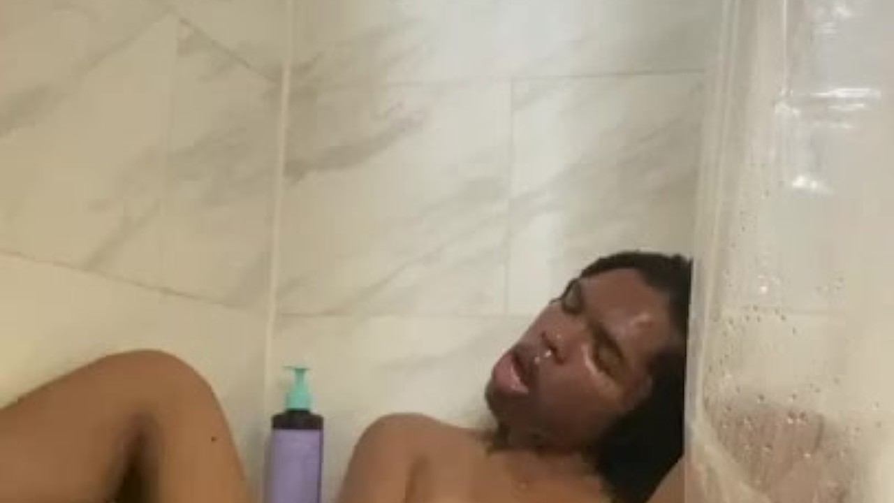 sydney in a hot shower playing with her dick