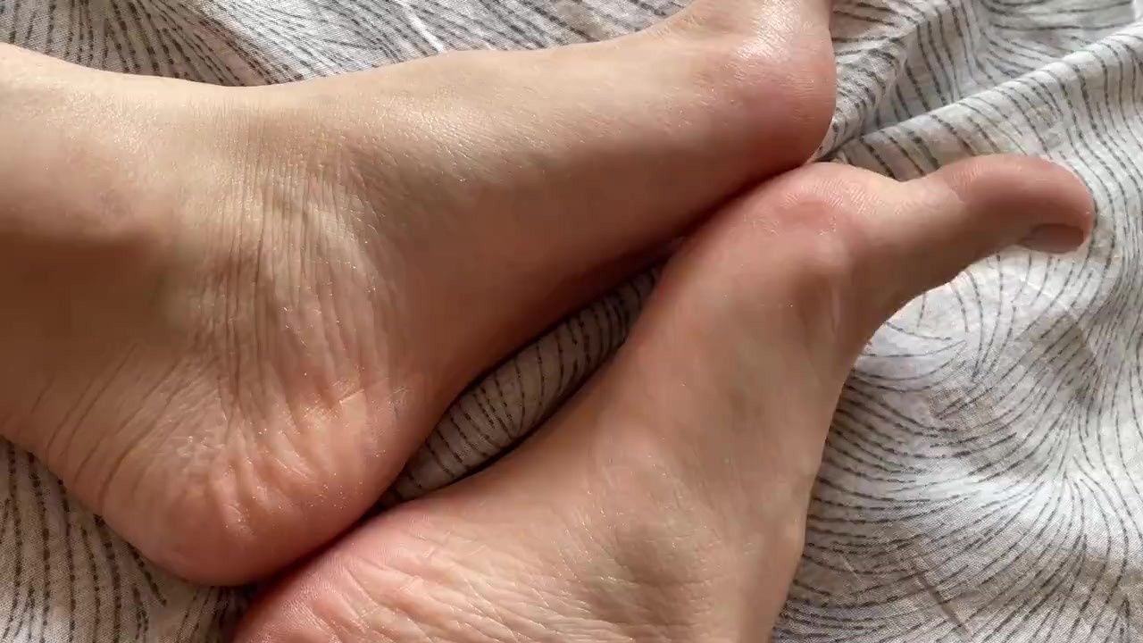 Toes with beige pedicure