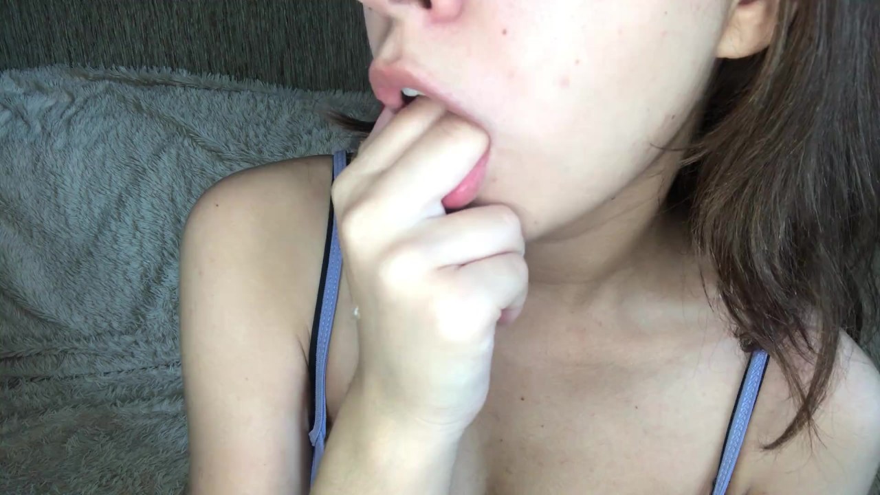 Girl licking her fingers