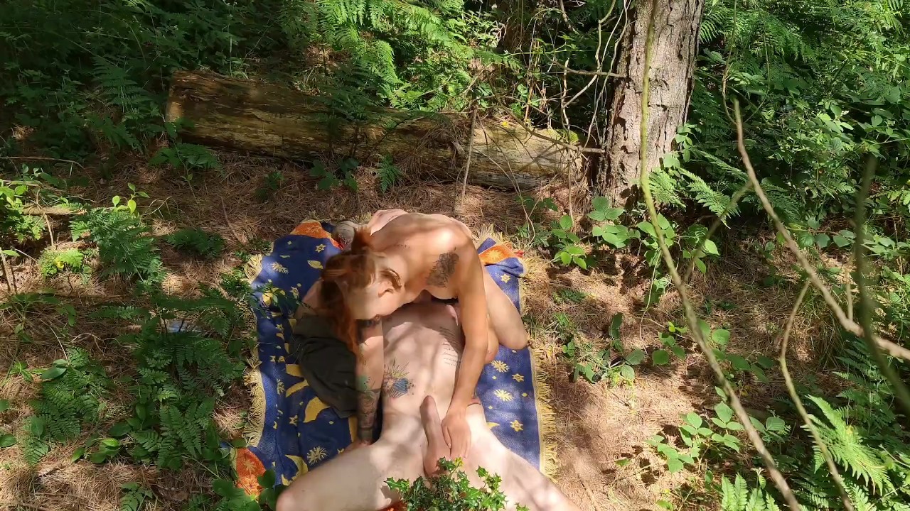 Passionate Redhead rides a hard cock in the WOODS!