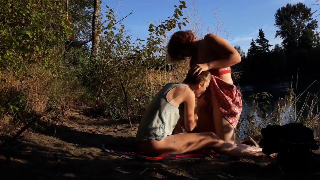 Two trans teens take a risky fuck outdoors by a river. Trans couple