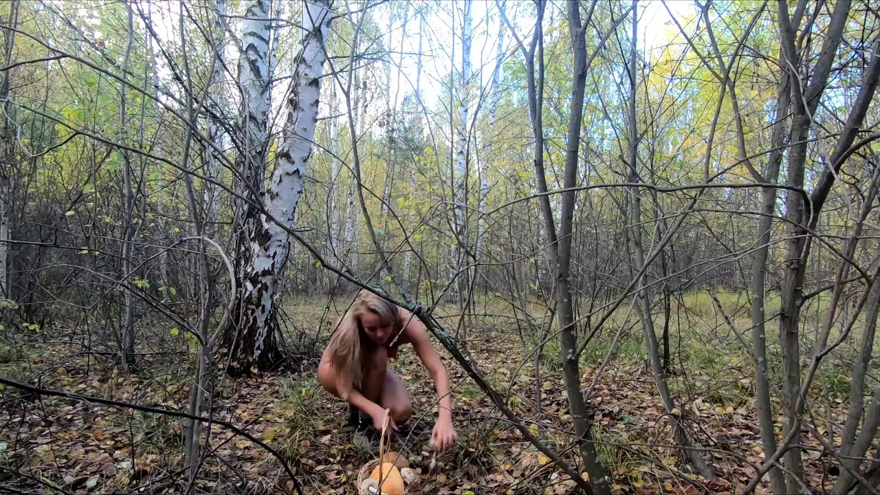 Nude Picking mushrooms in the forest