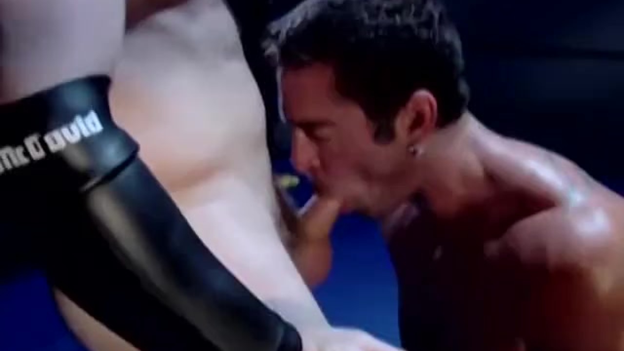 Two hunky wrestlers suck each other off in the ring