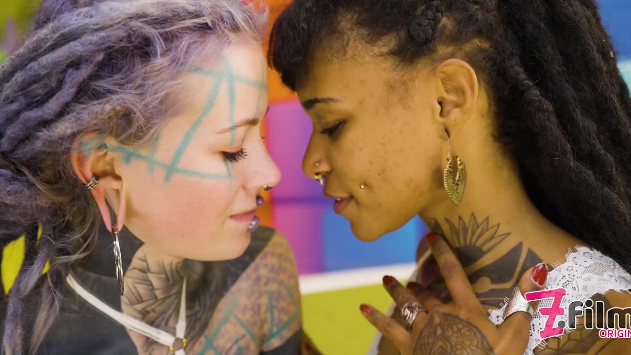 Interracial lesbian sex - FEMDOM exotic teen with strap on - HEAVILY TATTOOed dominatrix - goth alt punk