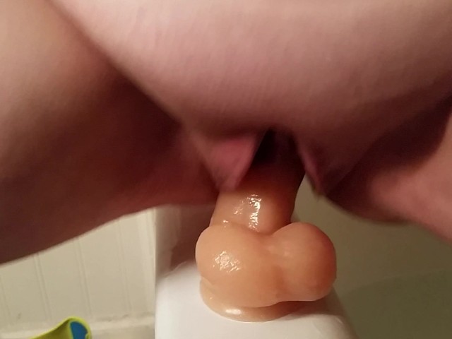 Fucking my suction cup dildo in the bathtub part 2 image