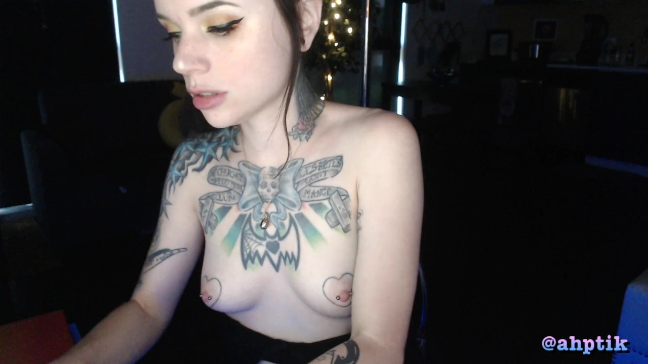 tattooed cam girl sucks and gags on dildo