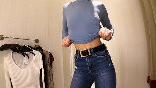 Sexy teen with small tits try-on haul slim blouses, pullovers in dressing room.