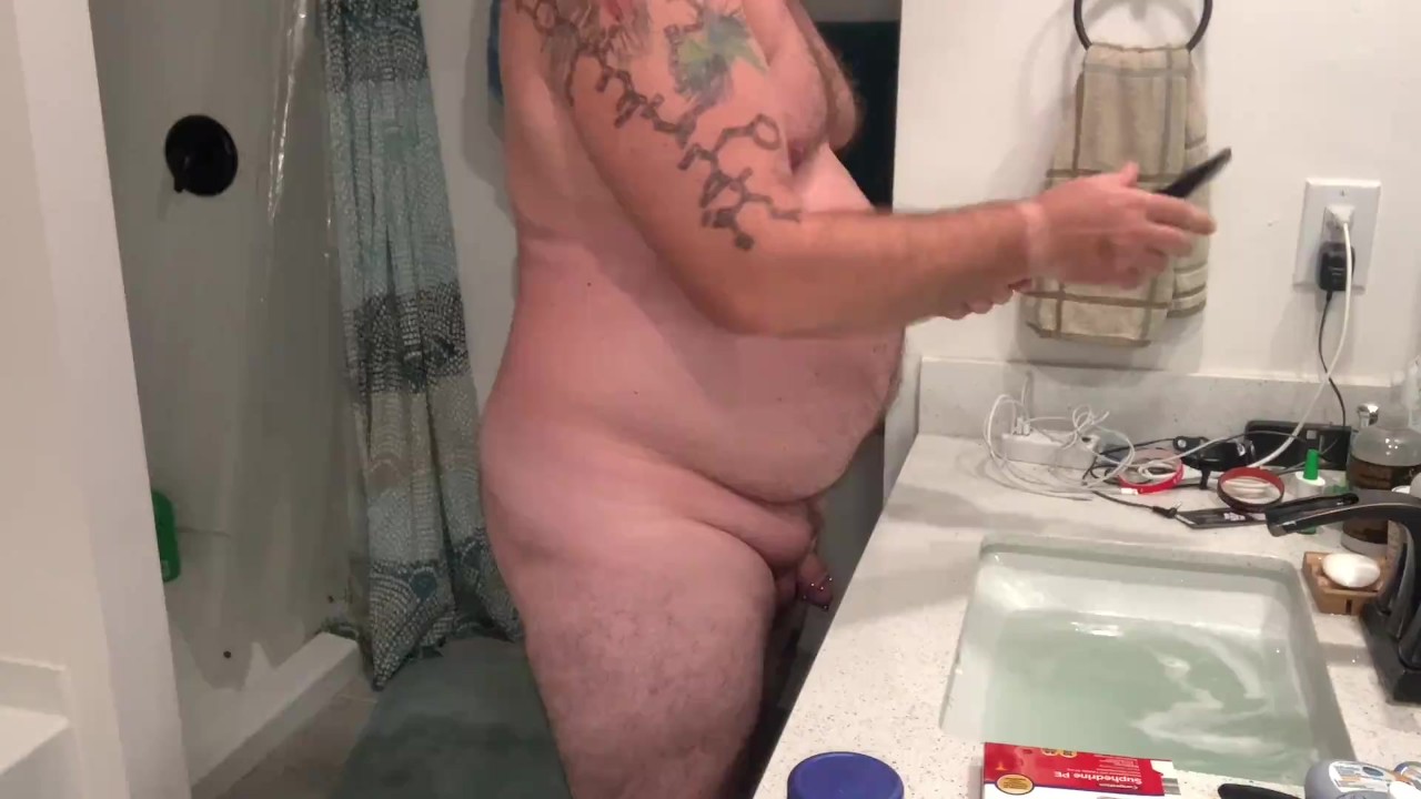 Dad bod shaving face and crotch